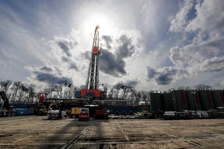 In this March 12, 2020, file photo, the sun shines through clouds above a shale gas drilling site in St. Mary's, Pa. (Keith Srakocic / AP Photo)