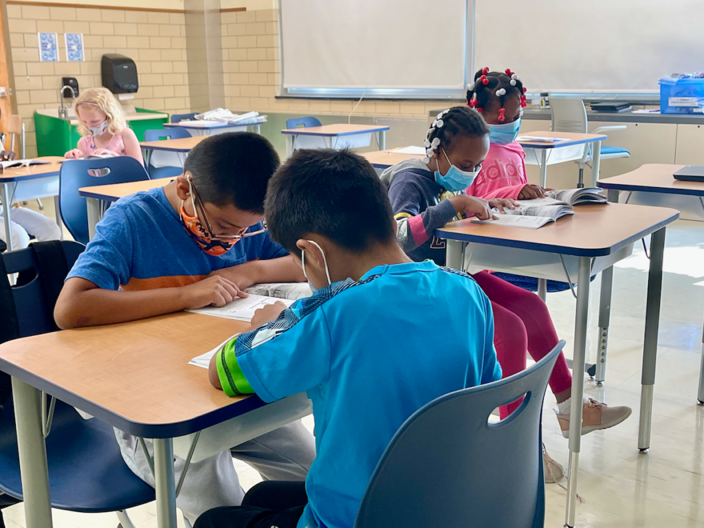 Students work on assignments during a summer school program