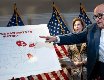 Rudy Giuliani points to a map as he speaks to the press about various lawsuits related to the 2020 election on Nov. 19, 2020. He and other Trump lawyers are now under scrutiny for their roles in promoting false claims of election fraud. (Drew Angerer/Getty Images)