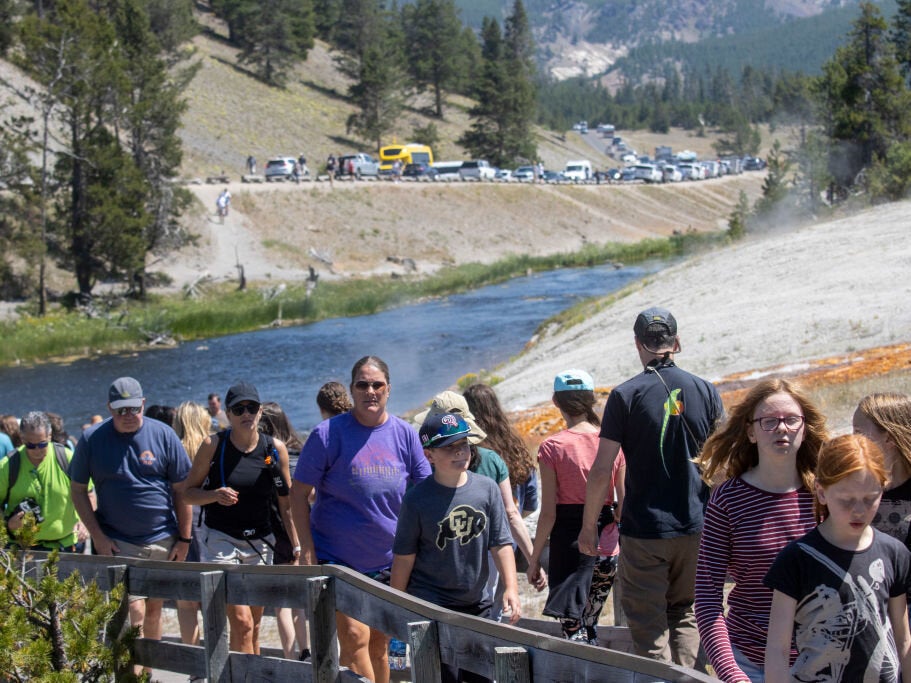 Tourists crowd in to the Midway Geyser Basin