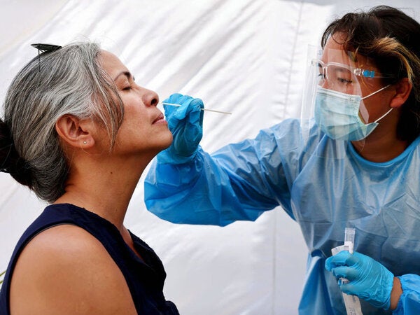 A medical assistant administers a COVID-19 test