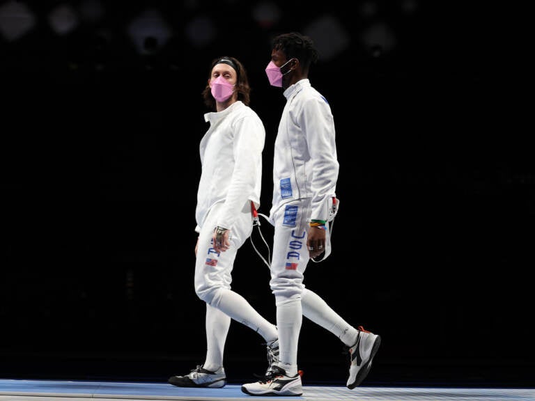 American's Jacob Hoyle and Curtis McDowald wear pink face masks after losing to Japan in Men's  Épée. (Elsa/Getty Images)