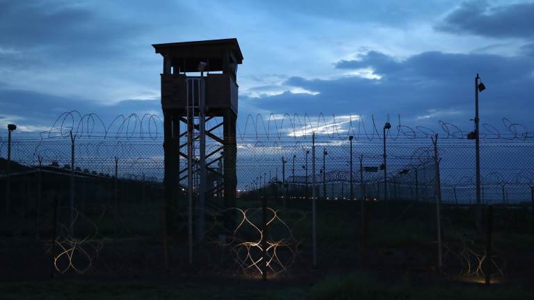 Razor wire and a guard tower stands at a closed section of the U.S. prison at Guantánamo Bay on Oct. 22, 2016. (John Moore/Getty Images)