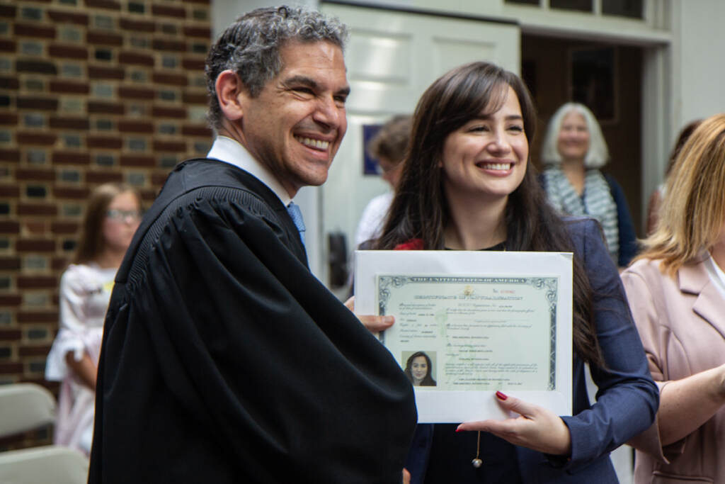 Thayse Porto Mota Conte poses with Judge Joshua D. Wolson