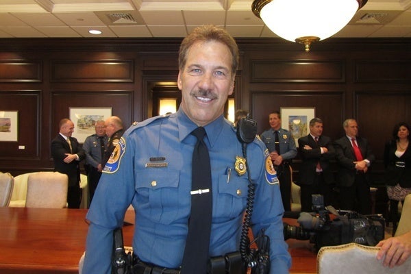 Michael Capriglione wearing a police uniform