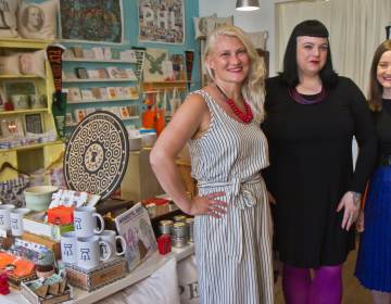 Owners Tiffica Benza (left), Ashley Peel (center), and Jennifer Provost (right) at their boutique, Philadelphia Independents in Old City. (Kimberly Paynter/WHYY)