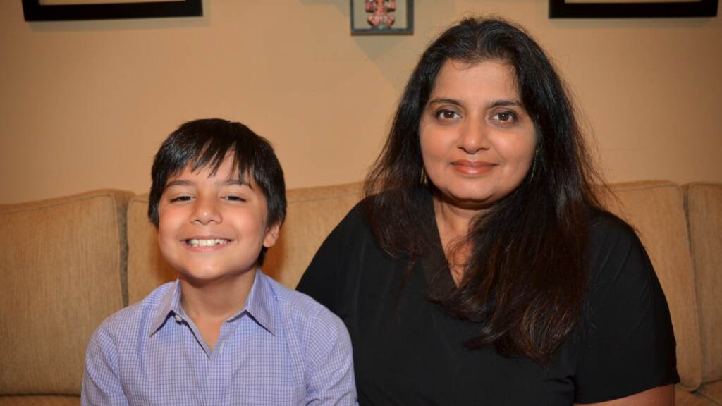 Purnima Montagne sits with her son Thejas