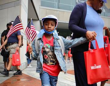 Naeem Townsend leaves the National Constitution Center with a hat, a flag, and a hoagie, giveaways