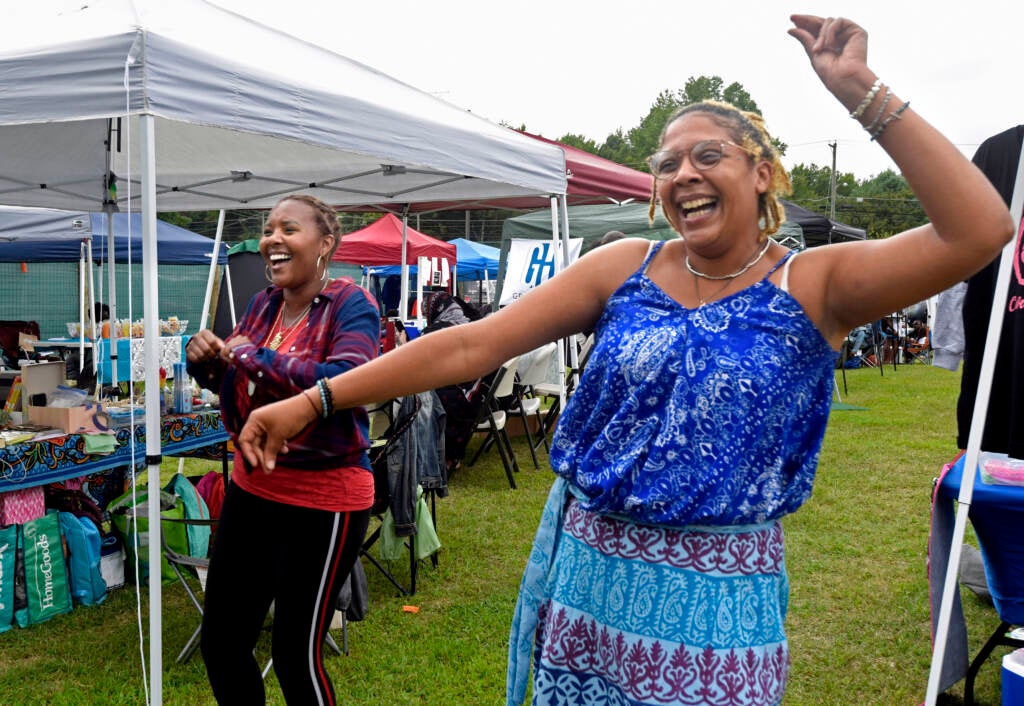 Two people pose at grand opening of Mask Melanin Market in Glassboro.