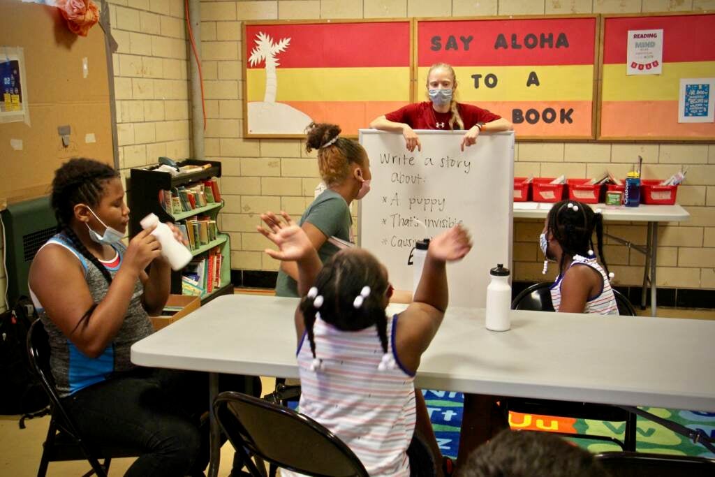 Emily Rankin gives her class at McVeigh Recreation Center a writing prompt