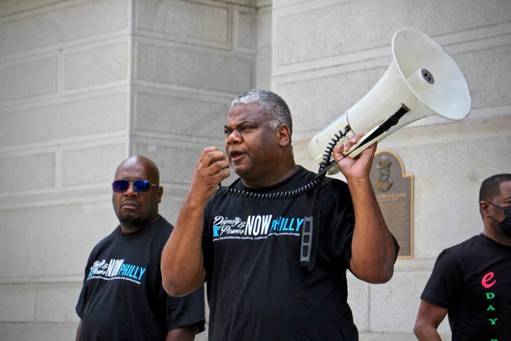 Reuben Jones speaks into a bullhorn