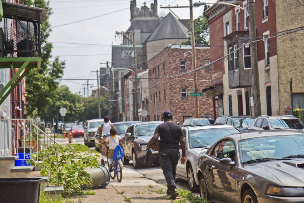 A person walks down the street in Mantua