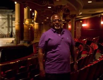 Cornell Wood stands inside the Academy of Music