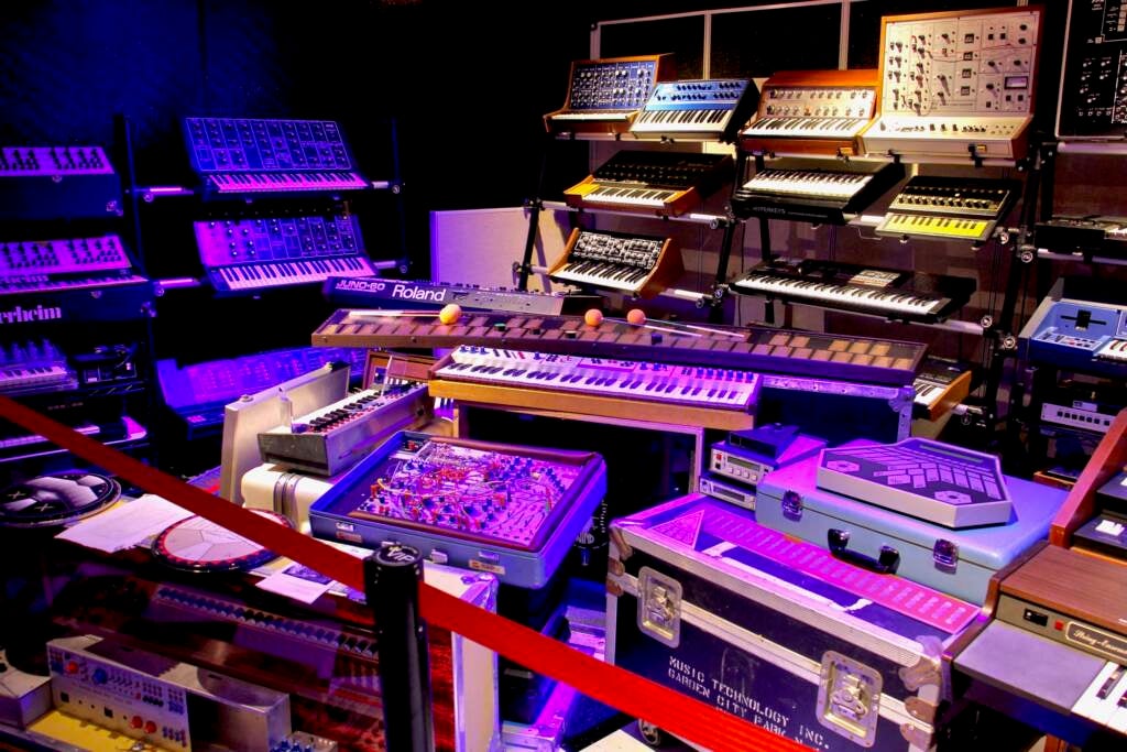 Synthesizer devices are piled in a room