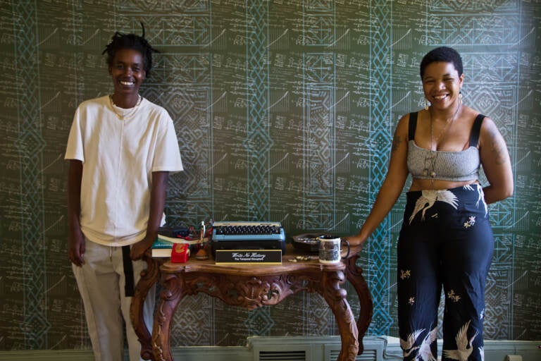 Camae Ayewa (left) and Rasheedah Phillips (right), the artists of Black Quantum Futurism and makers of the film “Write No History” with their work in Philadelphia’s historic Hatfield House