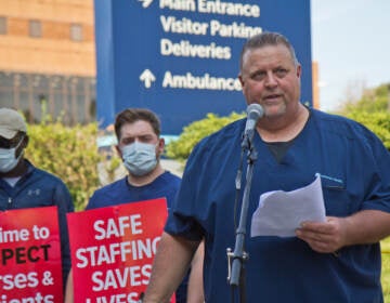 Kevin Diamond speaks outside Jefferson Hospital as part of a rally