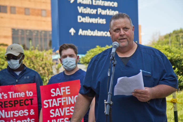 Kevin Diamond speaks outside Jefferson Hospital as part of a rally