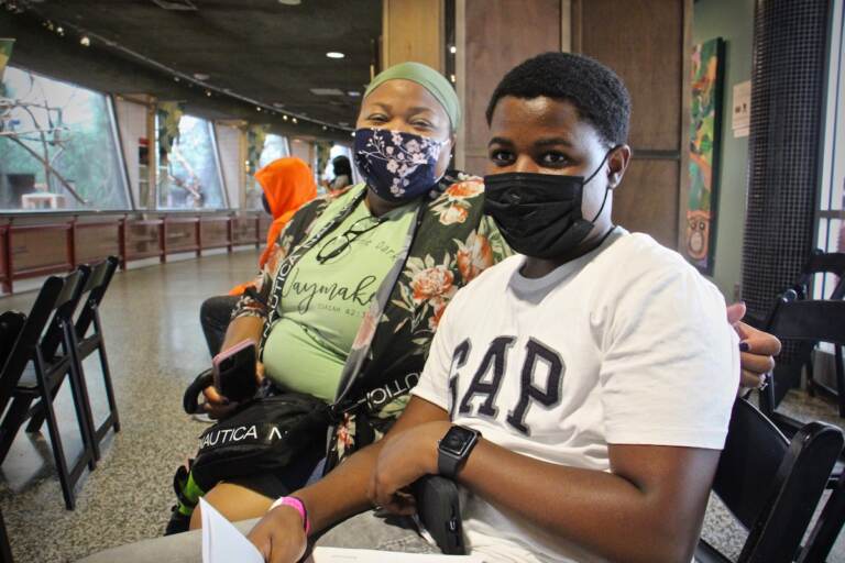 Viola Dales brought her son Raheem Dales, a sophomore at Parkway West High School, to the Philadelphia Zoo to get his COVID-19 vaccine. (Emma Lee/WHYY)