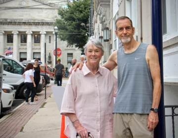 Fifty years ago, Bonnie Raines and Keith Forsyth were among a group of activists who broke into an FBI office in Media, Pa. and made off with classified documents exposing illegal FBI investigations. They are standing at the site where a historical marker will commemorate the break-in. (Emma Lee/WHYY)