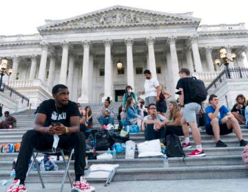 Supporters of Rep. Cori Bush, D-Mo., camp with her outside the U.S. Capitol, in Washington, Monday, Aug. 2, 2021, as anger and frustration has mounted in Congress after a nationwide eviction moratorium expired at midnight Saturday. (AP Photo/Jose Luis Magana)