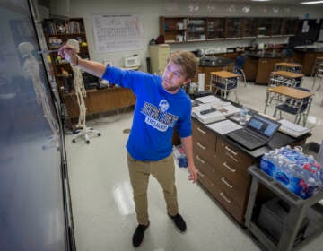 Johnson County High School teacher Michael Caneege teaches anatomy to his students online, Friday, Aug., 20, 2021, in Wrightsville, Ga. A few weeks into the new school year, growing numbers of U.S. districts have halted in-person learning or switched to hybrid models because of rapidly mounting coronavirus infections. With 40% of students in quarantine or isolation, the Johnson County district shifted last week to online instruction until Sept. 13. (AP Photo/Stephen B. Morton)