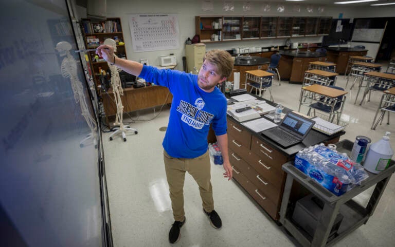 Johnson County High School teacher Michael Caneege teaches anatomy to his students online, Friday, Aug., 20, 2021, in Wrightsville, Ga. A few weeks into the new school year, growing numbers of U.S. districts have halted in-person learning or switched to hybrid models because of rapidly mounting coronavirus infections. With 40% of students in quarantine or isolation, the Johnson County district shifted last week to online instruction until Sept. 13. (AP Photo/Stephen B. Morton)