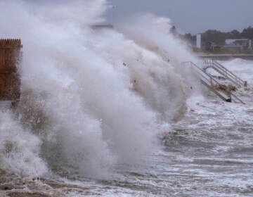 Waves pound seawall in Montauk, N.Y., Sunday, Aug. 22, 2021, as Tropical Storm Henri affects the Atlantic coast. (AP Photo/Craig Ruttle)