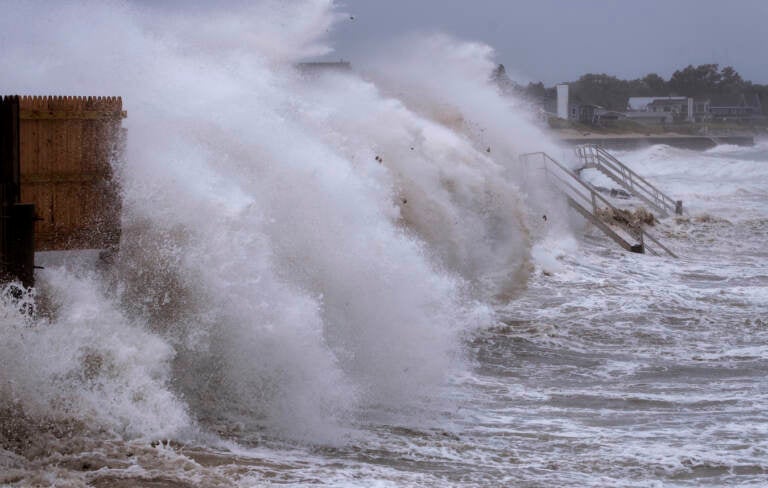 Waves pound seawall in Montauk, N.Y., Sunday, Aug. 22, 2021, as Tropical Storm Henri affects the Atlantic coast. (AP Photo/Craig Ruttle)