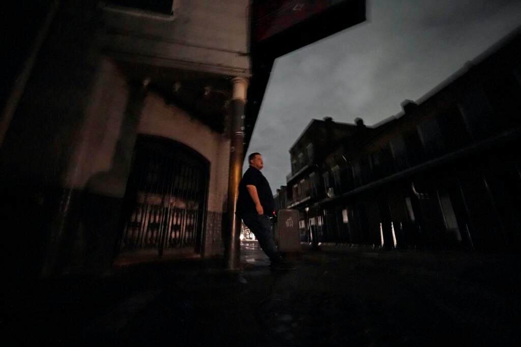 Greg Nazarko leans against a pole outside the Bourbon Bandstand bar after a storm