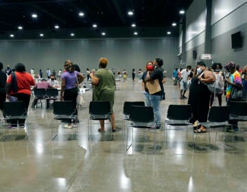 Applicants line up at a rental assistance fair