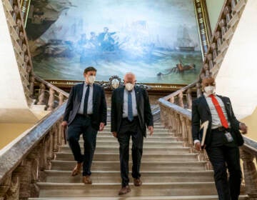 Bernie Sanders walks towards the Senate floor