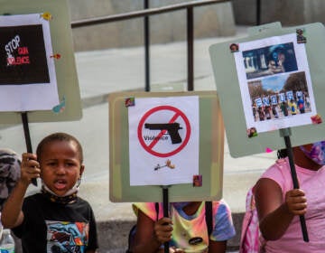 File photo: A group of kids from the Southwest Philadelphia Healthnastics program, ages 3-18, held signs at a protest demanding the Kenney administration do more to address gun violence in the city on August 4, 2021. (Kimberly Paynter/WHYY)
