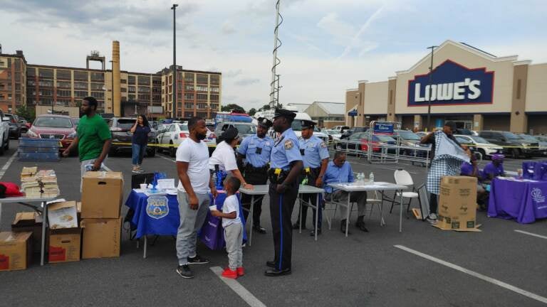 Marvin Ebron and son MJ speak to a police officer