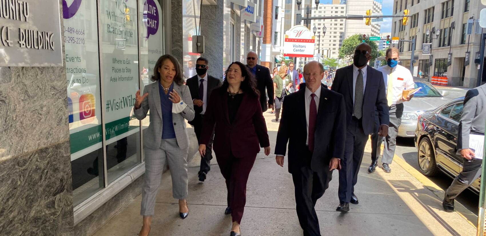 Isabella Casillas Guzman (center) tours tours downtown Wilmington businesses alongside U.S. Sen. Chris Coons and U.S. Rep. Lisa Blunt Rochester