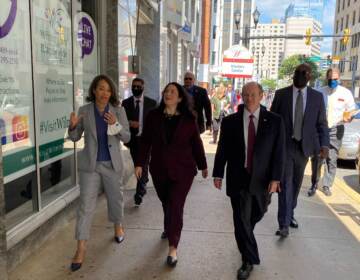 Isabella Casillas Guzman (center) tours tours downtown Wilmington businesses alongside U.S. Sen. Chris Coons and U.S. Rep. Lisa Blunt Rochester