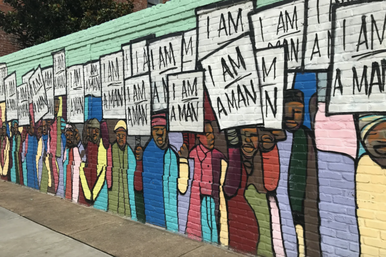 A mural depicts the 1968 sanitation worker strike in Memphis.