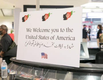 A sign welcomes Afghan refugees at PHL airport.