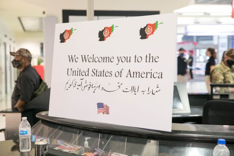 A sign welcomes Afghan refugees at PHL airport.