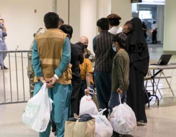 Afghan refugees arrive at Philadelphia international terminal.