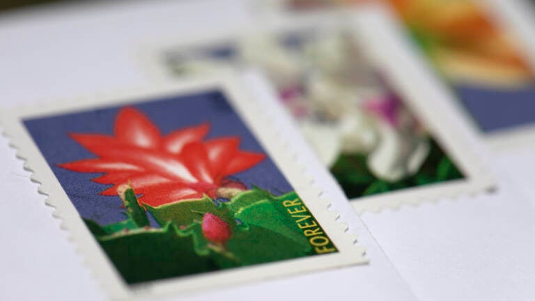 The price of a first-class stamp will go up 3 cents later in August to help pay for service changes. (Jenny Kane/AP)