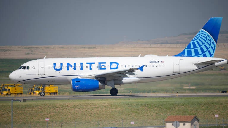 A United Airlines jetliner taxis down a runway for take off from Denver International Airport last month. The carrier has become the first major U.S. airline to require employees be vaccinated against COVID-19. (David Zalubowski/AP)