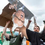 The crowd passing around the cutout.
Laura Jane Grace and Brendan Kelly playing an acoustic show at Four Seasons Total Landscaping in Philadelphia, Pa. on 8/21/21. (Daniella Heminghaus for Billy Penn)