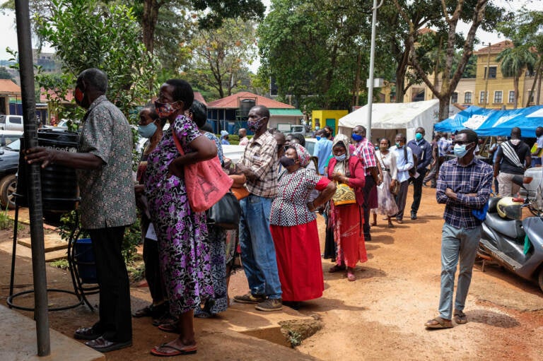 People line up last week to receive COVID-19 vaccines in Kampala, Uganda