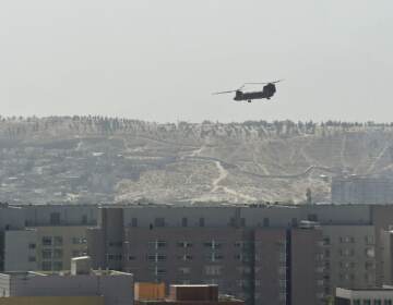 A U.S. military helicopter is pictured flying above the U.S. Embassy in Kabul