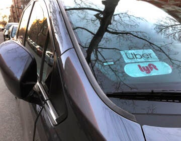 Uber and Lyft sign in windshield of car, Queens, New York. (Education Images/Lindsey Nicholson/Education Images/Universal Images Group via Getty Images)