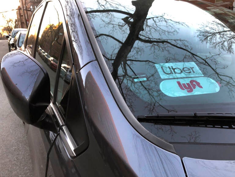 Uber and Lyft sign in windshield of car, Queens, New York. (Education Images/Lindsey Nicholson/Education Images/Universal Images Group via Getty Images)
