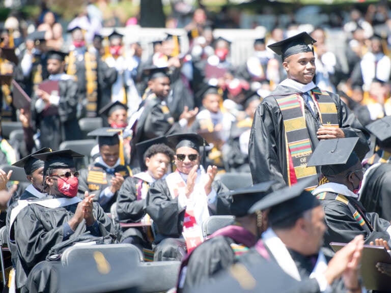 Students applaud at the Morehouse College commencement ceremony on May 16, 2021, in Atlanta. Morehouse recently announced it would clear remaining tuition balances for students, joining several other HBCUs doing the same. (Marcus Ingram/Getty Images)