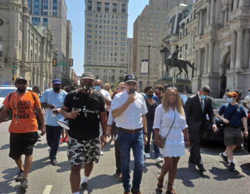 Jamal Johnson, Larry Krasner, Jamie Gauthier, and others march in a protest against gun violence