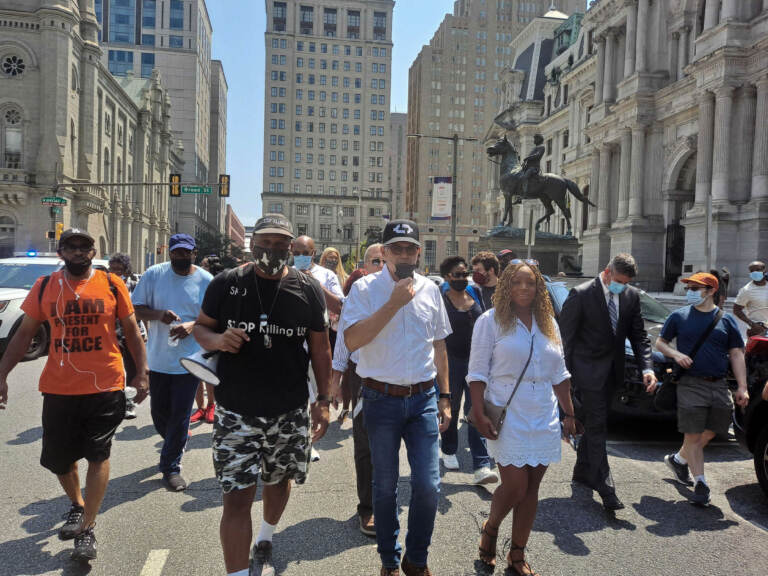 Jamal Johnson, Larry Krasner, Jamie Gauthier, and others march in a protest against gun violence