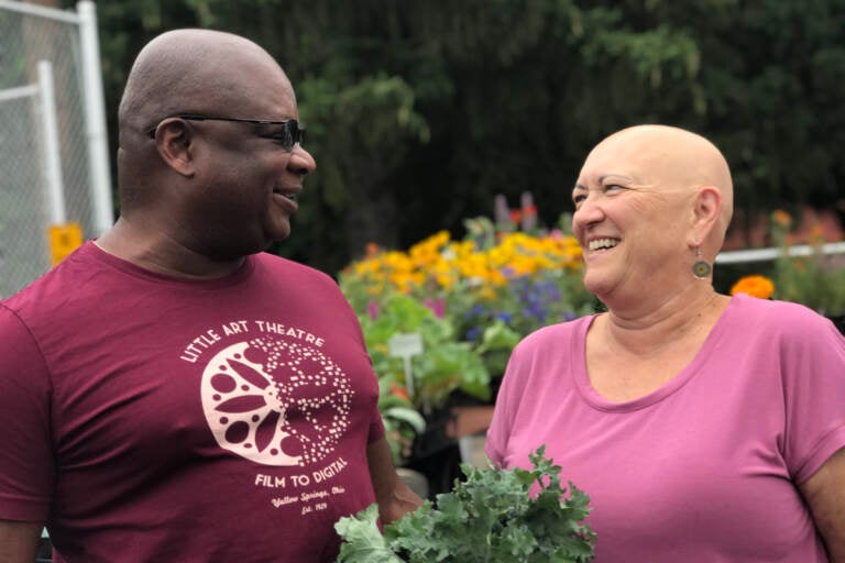 Kevin and Karen Gardner at the farmer’s market in Yellow Springs, near Dayton, Ohio. (Jocelyn Robinson/For WHYY)